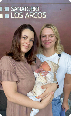 Mother holding baby — childbirth in Argentina